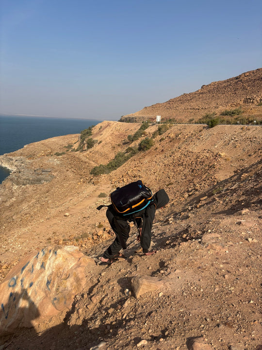 Traveller with TREKARIUS 35L backpack on a mountain trail overland